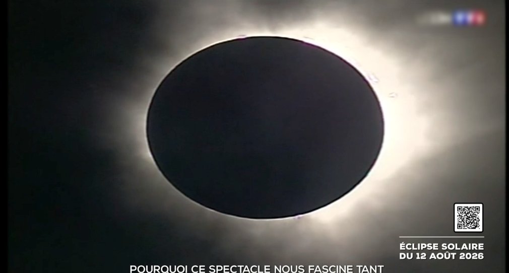 Total solar eclipse on live TV with an embedded QR code and an on-screen banner dated 12 August 2026